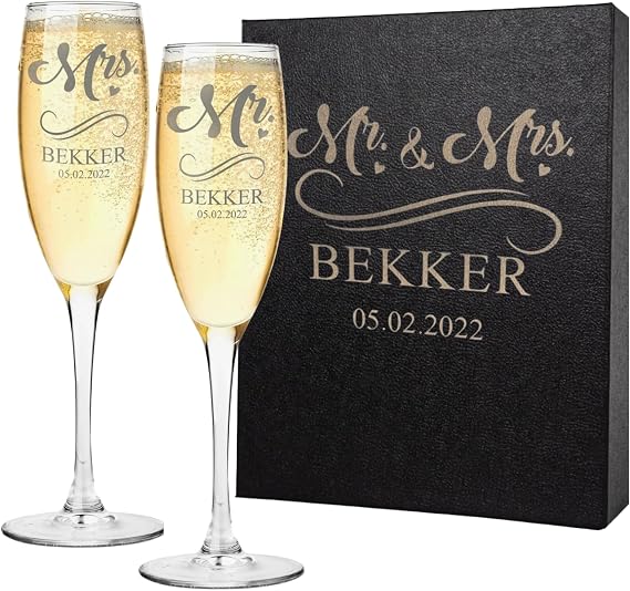 Personalized Champagne Flutes Set of 2, Engraved | Elegant stemmed glasses permanently engraved with your choice of 12 custom designs for weddings, anniversaries, and couples.